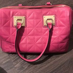 Pink purse with gold accents